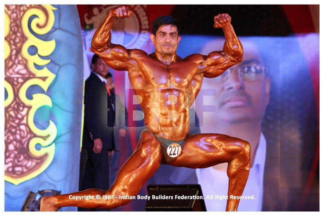 Mr. Promod Singh on stage during a competition