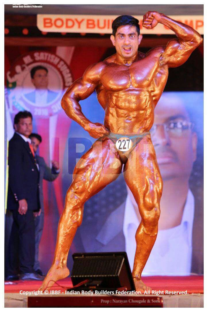 Mr. Promod Singh on stage during a competition