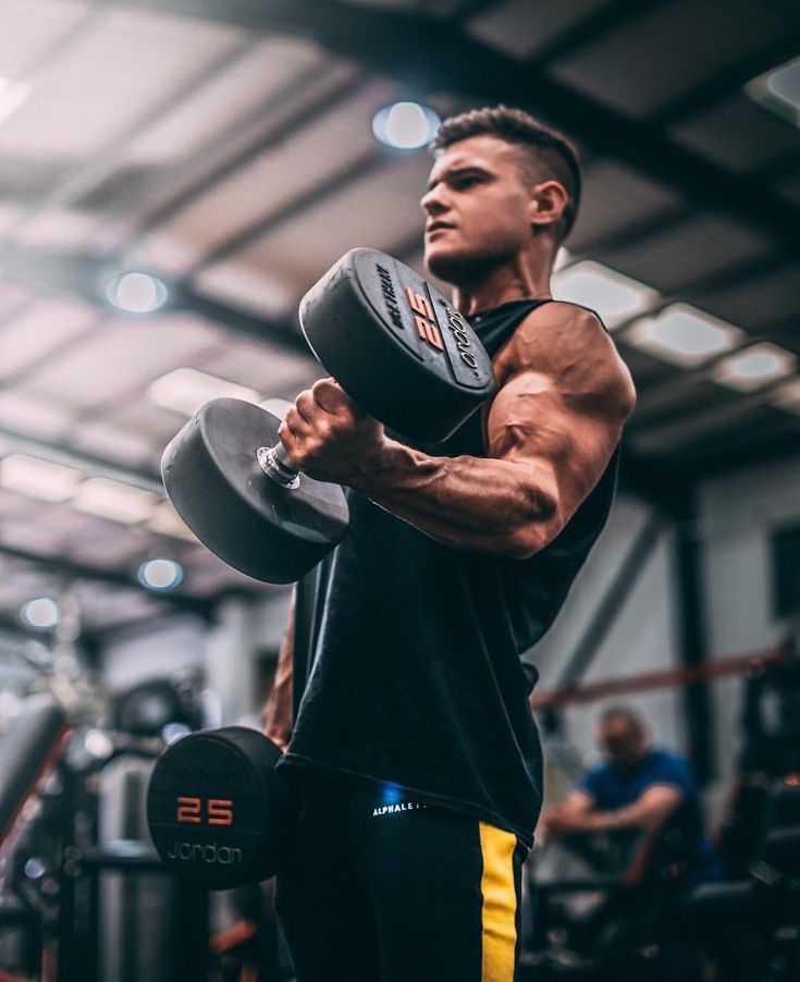 Gym owner standing confidently inside the training space